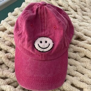 Pink smiley face hat